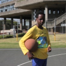 AFTER ELECTION: Frank Ndlovu takes the basket ball to court after voting.