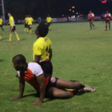 THE STRUGGLE: MGI and Mens Res both end up on the ground after a struggle to get the ball.
